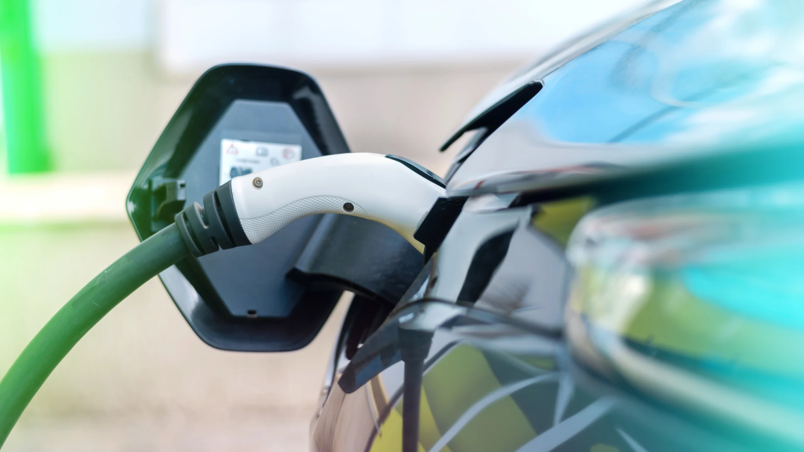 plugged-charger-into-electric-car-charge-station